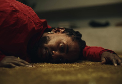 a person laying on the floor with their head on the floor