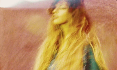 a blurry photo of a woman with long hair