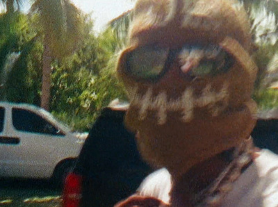 a person wearing a face mask and sunglasses