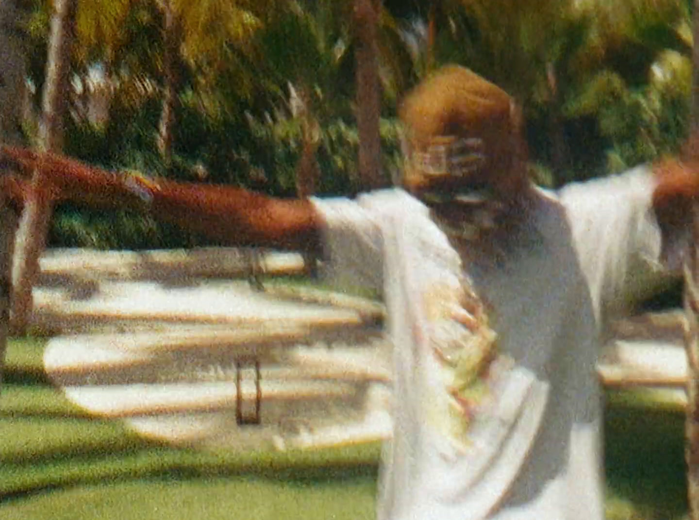 a blurry image of a man holding a frisbee