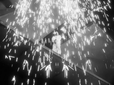 a black and white photo of fireworks