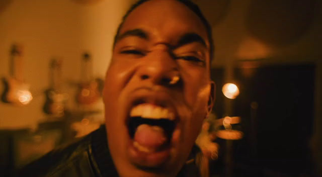 a man with his mouth open and his tongue out