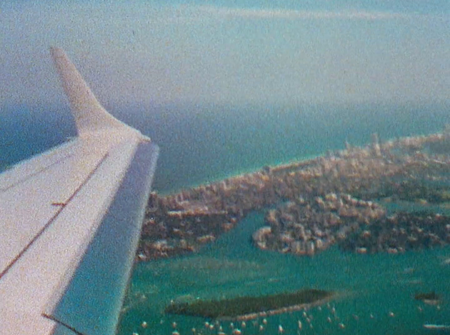 an aerial view of a city and a body of water