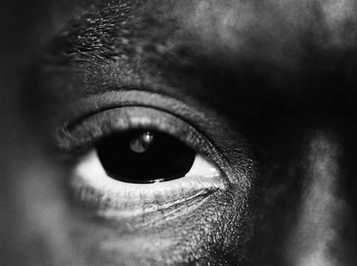 a black and white photo of a person's eye