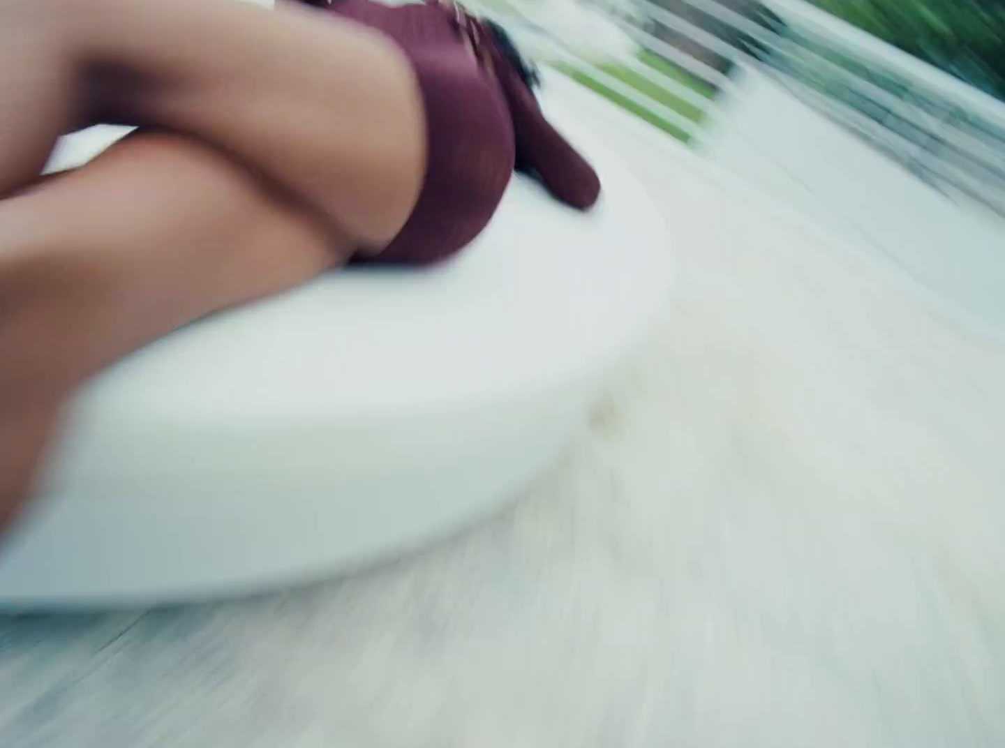 a woman is sitting on a white chair