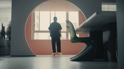 a man standing in front of a window in a room