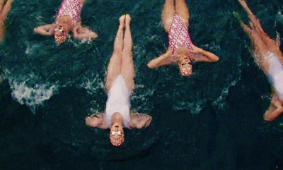 a group of people floating on top of a body of water