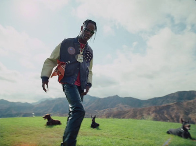 a man standing on top of a lush green field