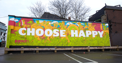 a large billboard with the words choose happy painted on it