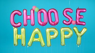 a group of balloons that say choose happy