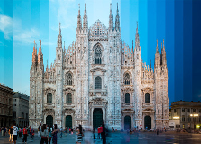 a group of people standing in front of a cathedral