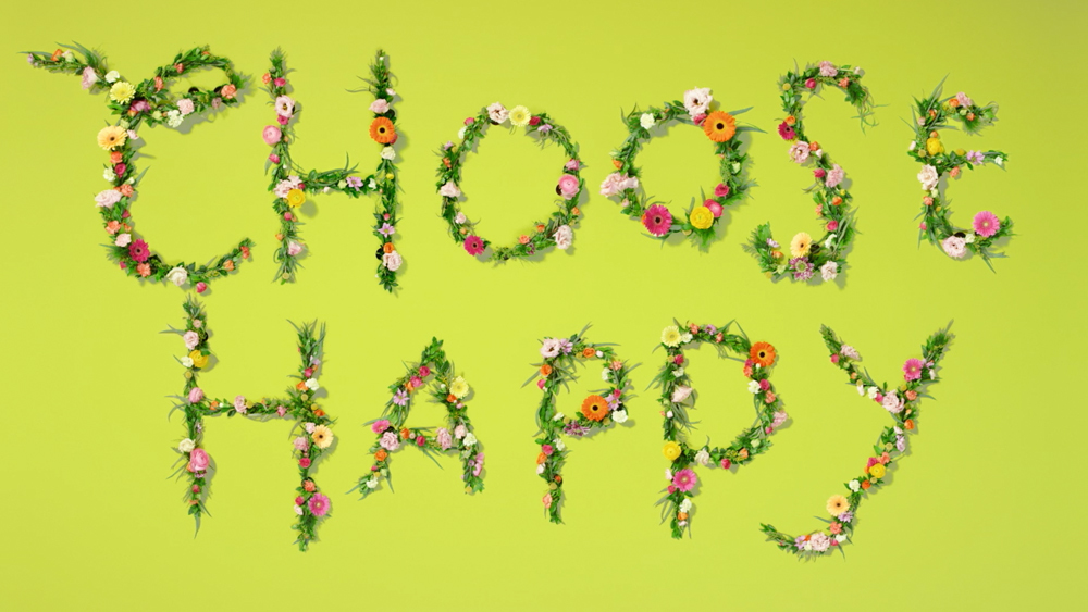 a green background with flowers and the words happy hooray