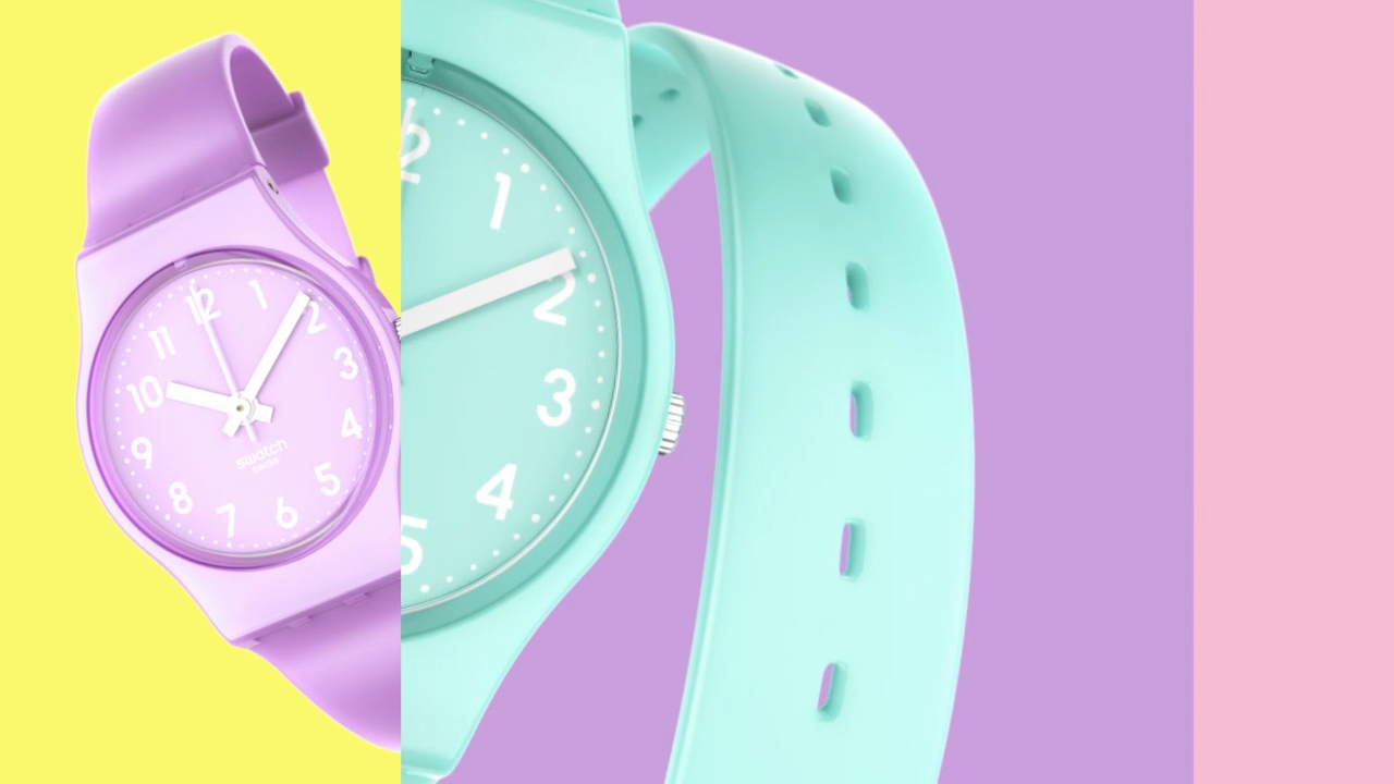 a watch and a watch band on a multicolored background