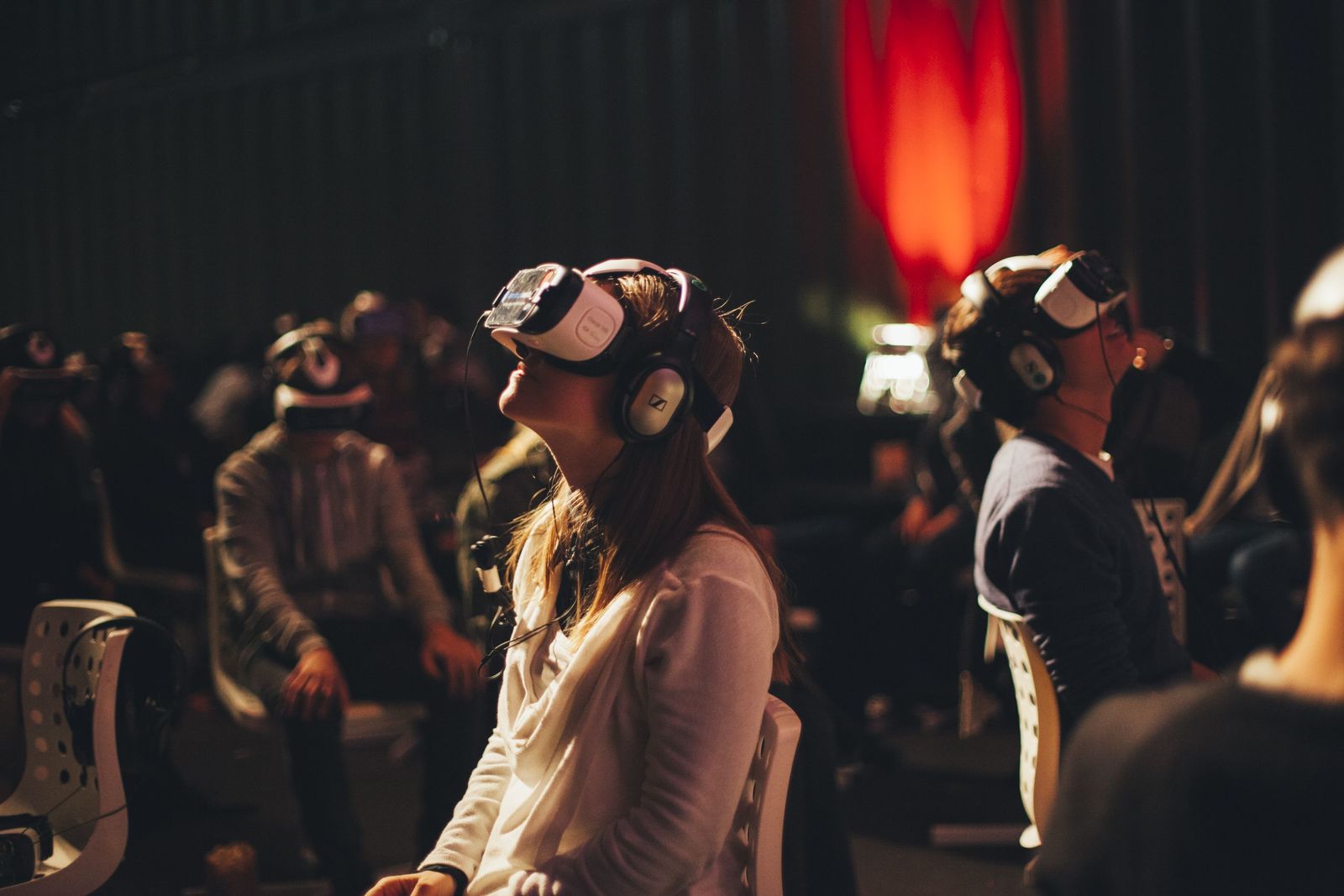 a group of people wearing headphones and listening to music