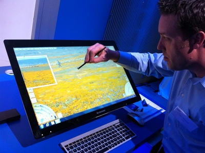 a man is drawing on a computer screen