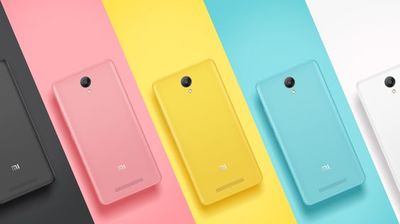 a row of four different colored smartphones