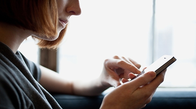 a close up of a person holding a cell phone