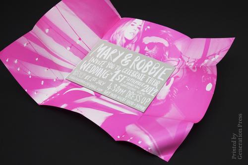 a close up of a pink paper with a label on it