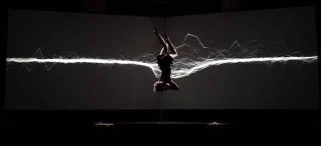 a person doing a handstand in the dark