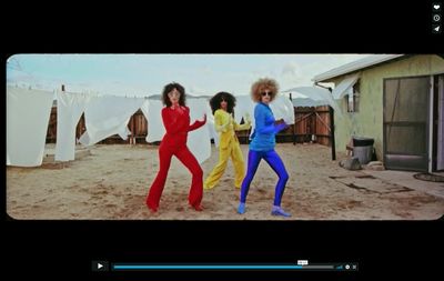 a screen shot of a group of women dancing