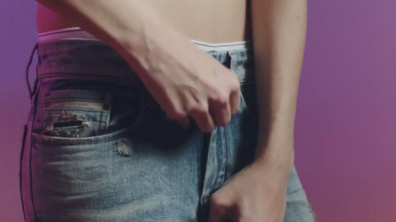 a close up of a person wearing a pair of jeans