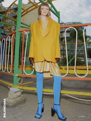 a woman standing in front of a playground