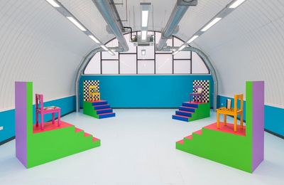 a brightly colored room with a blue wall