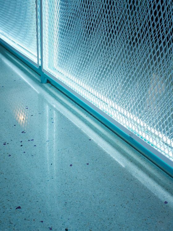 a close up of a metal fence on a floor