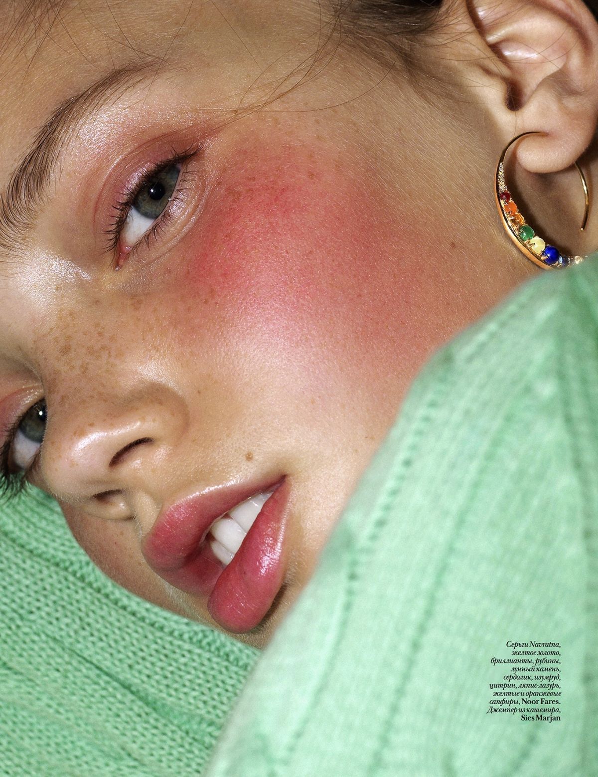 a young girl with freckles on her face