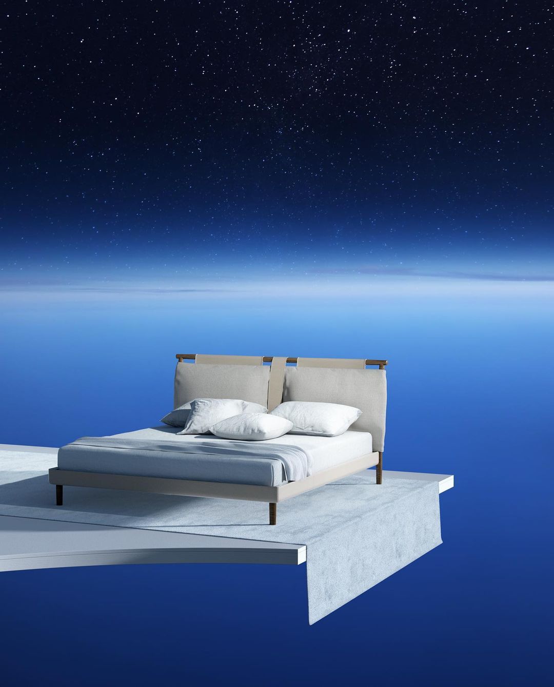 a bed sitting on top of a floating platform