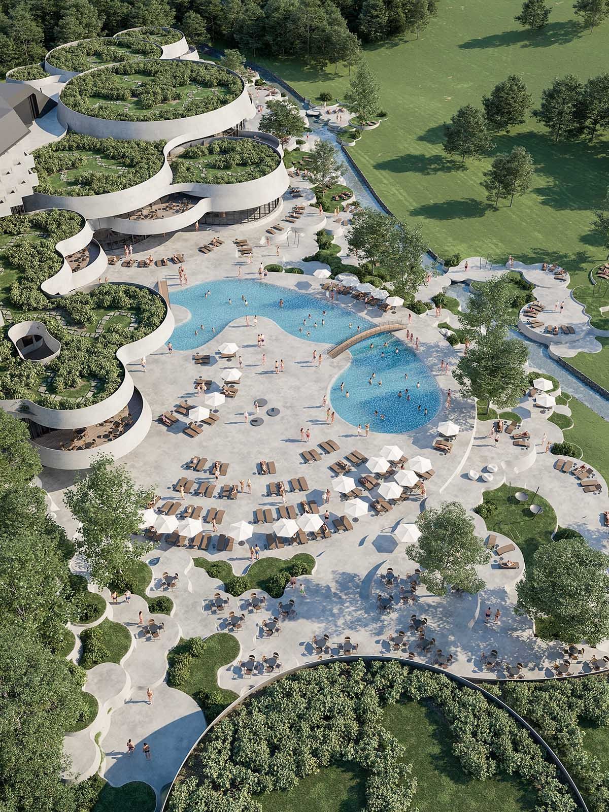 an aerial view of a resort with a swimming pool