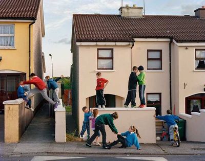 a group of people standing on top of a building