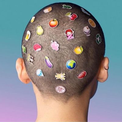 a man's head with a bunch of stickers on it