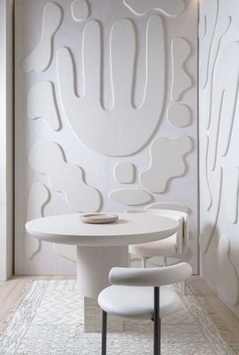 a white table and chairs in a room