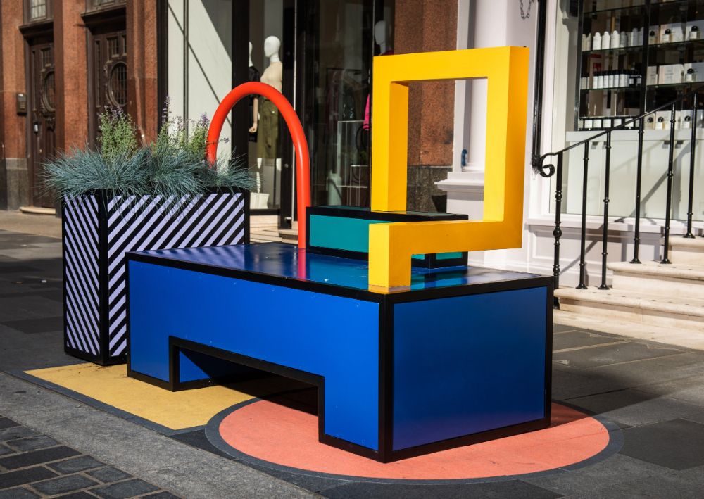 a colorful table with a plant on top of it