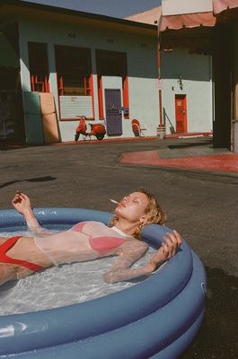 a woman laying in a pool of water