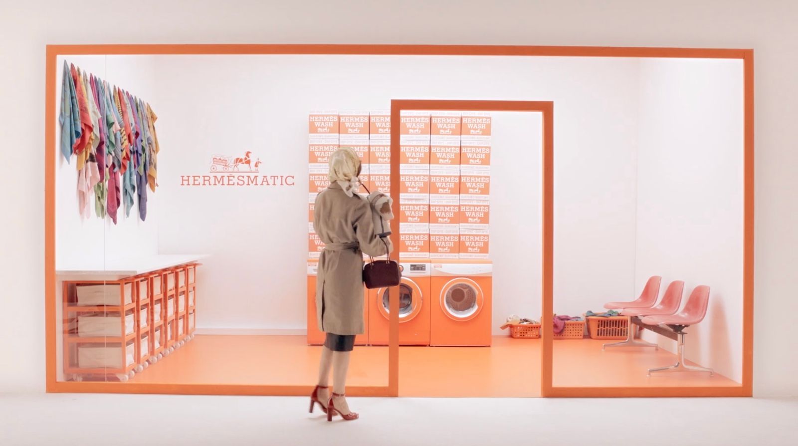 a woman standing in front of a washer and dryer