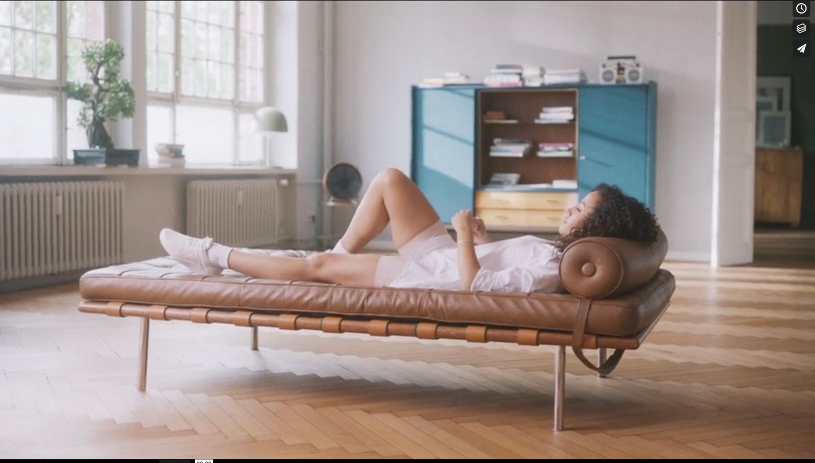 a woman laying on a couch in a room