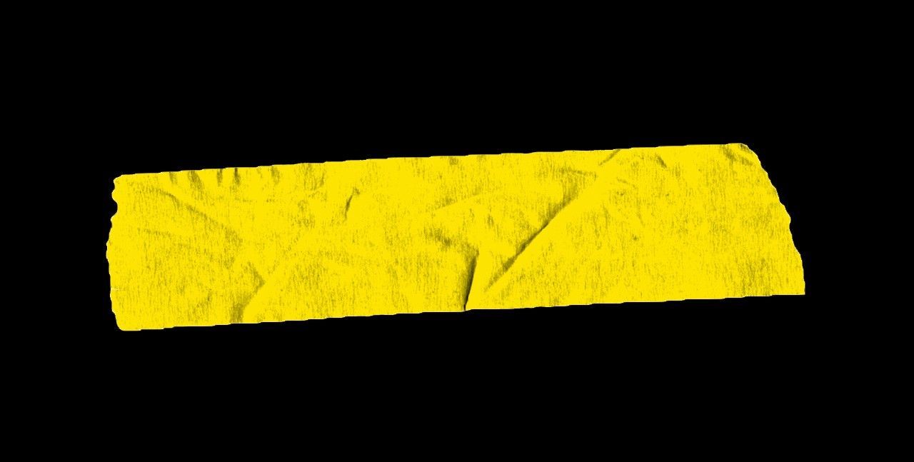 a yellow piece of paper with a black background