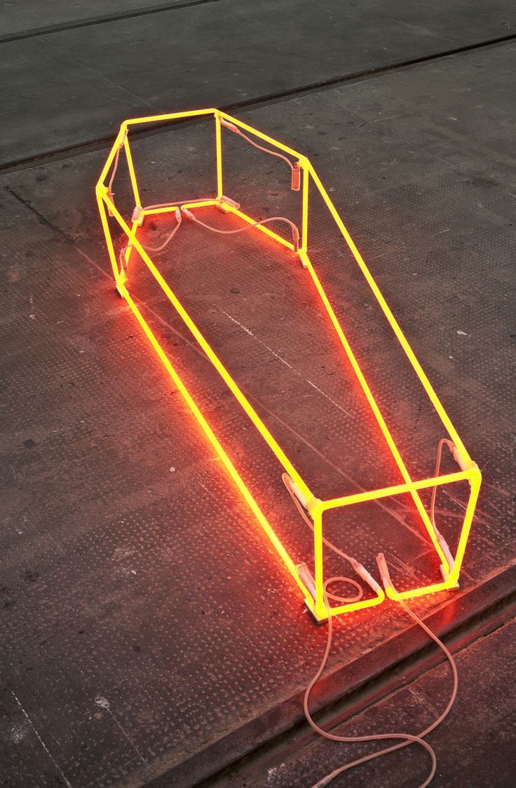 a neon object sitting on top of a floor