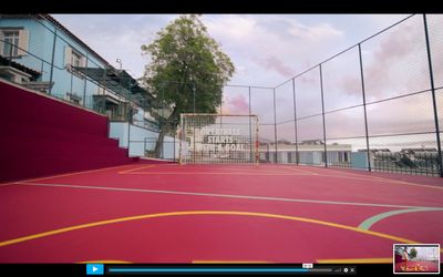 a tennis court with a red and yellow court