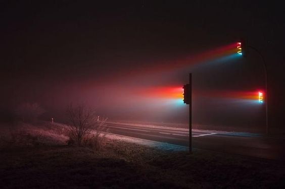 a traffic light sitting on the side of a road