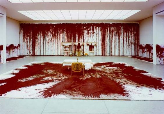 a large room with a lot of red paint on the walls