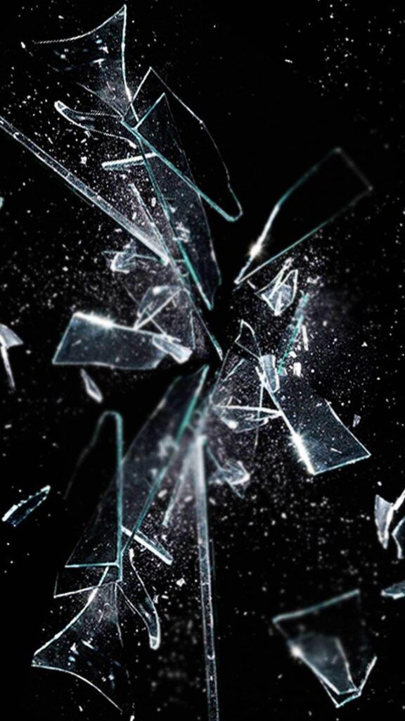 a broken glass window on a black background