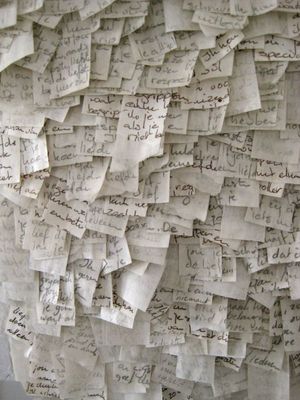 a bunch of papers with writing on them