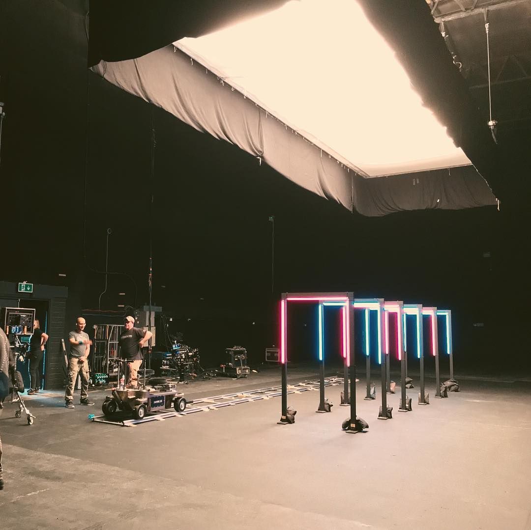 a group of people standing in a dark room