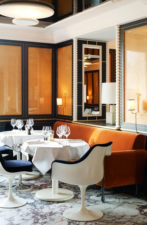 a dining room with a banquet table and chairs