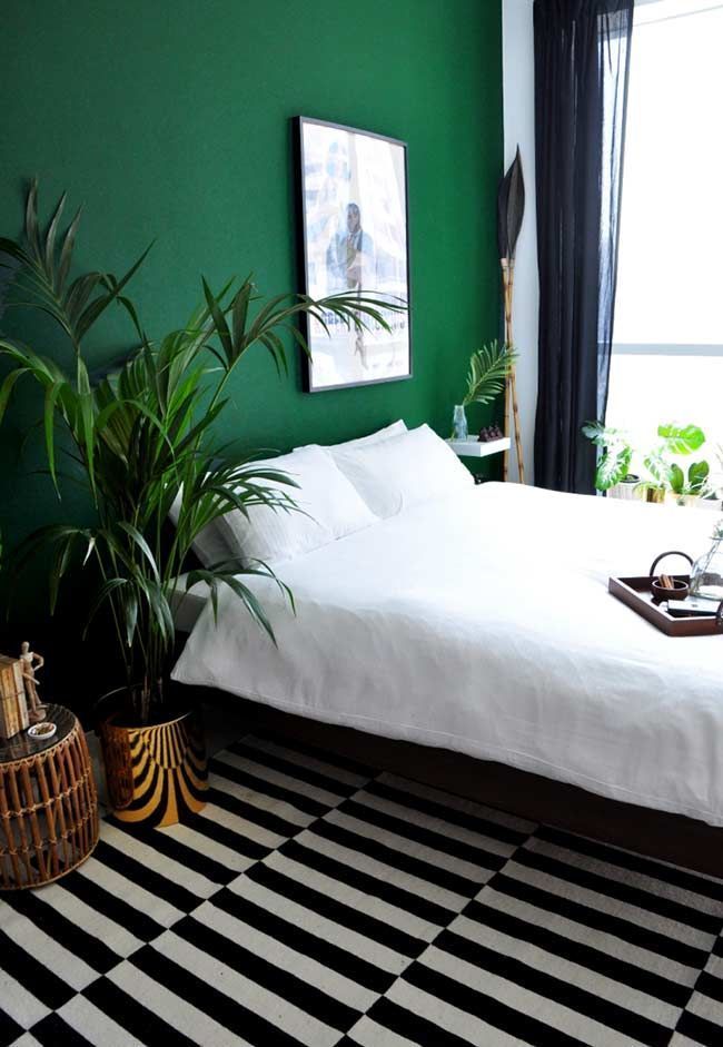 a bedroom with a black and white checkered floor