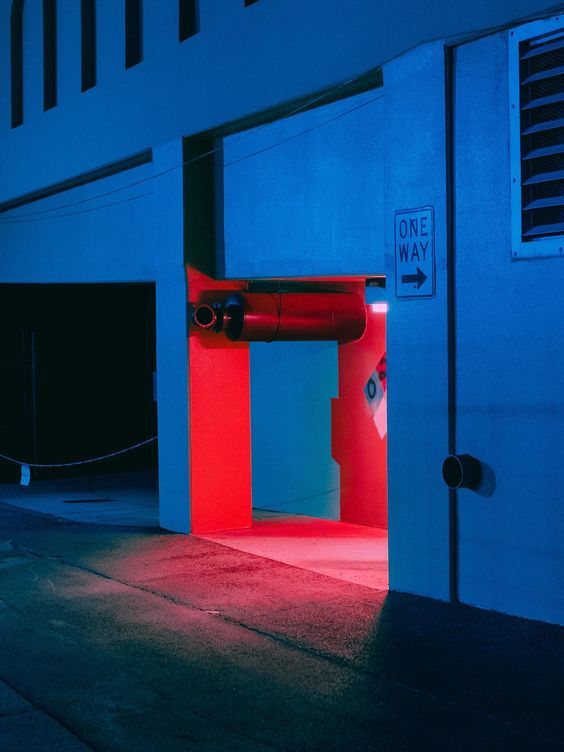 a building with a red and blue light coming out of it