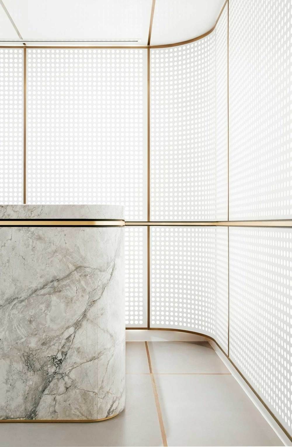 a marble counter in a room with white walls